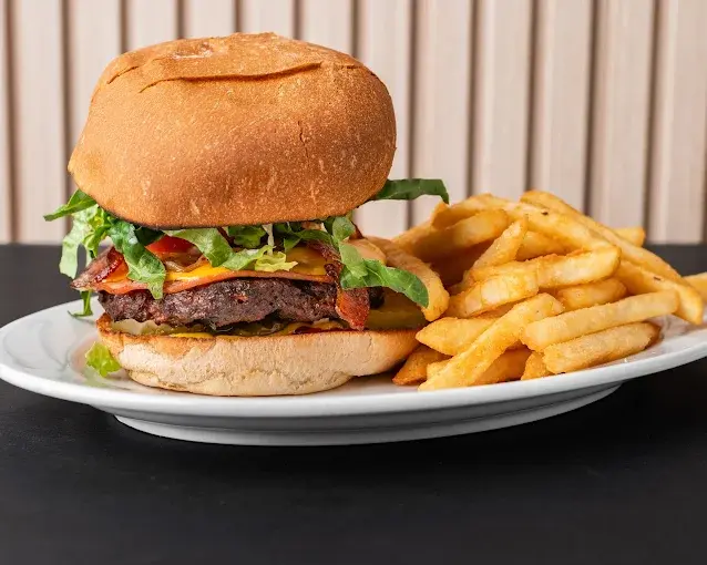 Steve's Famous Clubhouse sandwich fully loaded with turkey bacon vegetables at Edmonton deli